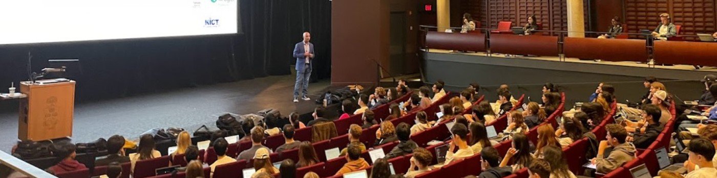 Ron Monteiro speaking to a large audience